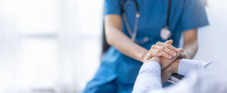 “Doctor providing care and reassurance with touch.”