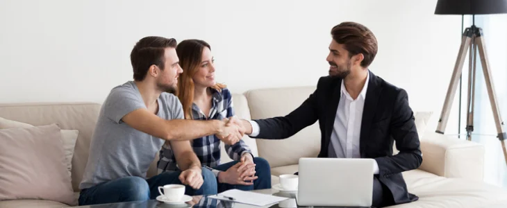 lawyer shaking hand of spouses